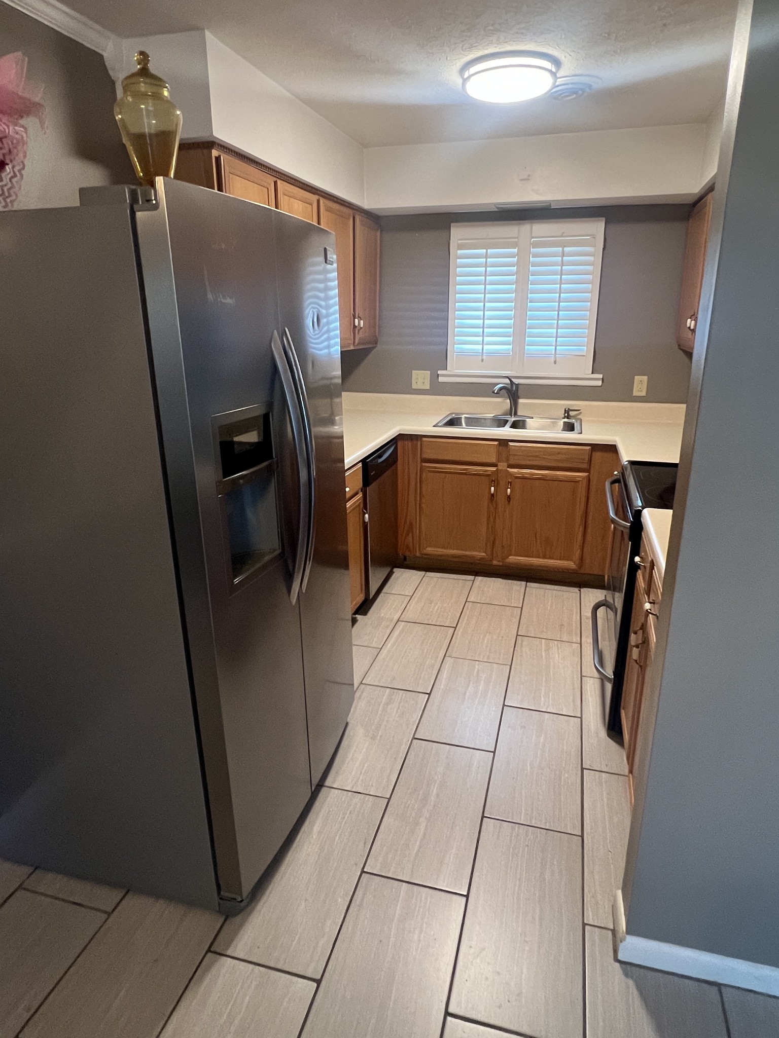 2169 Highway 41 South, Unit 28 Greenbrier, TN 37073 - Photo 3 of 7 a kitchen with a refrigerator a sink and a cabinets