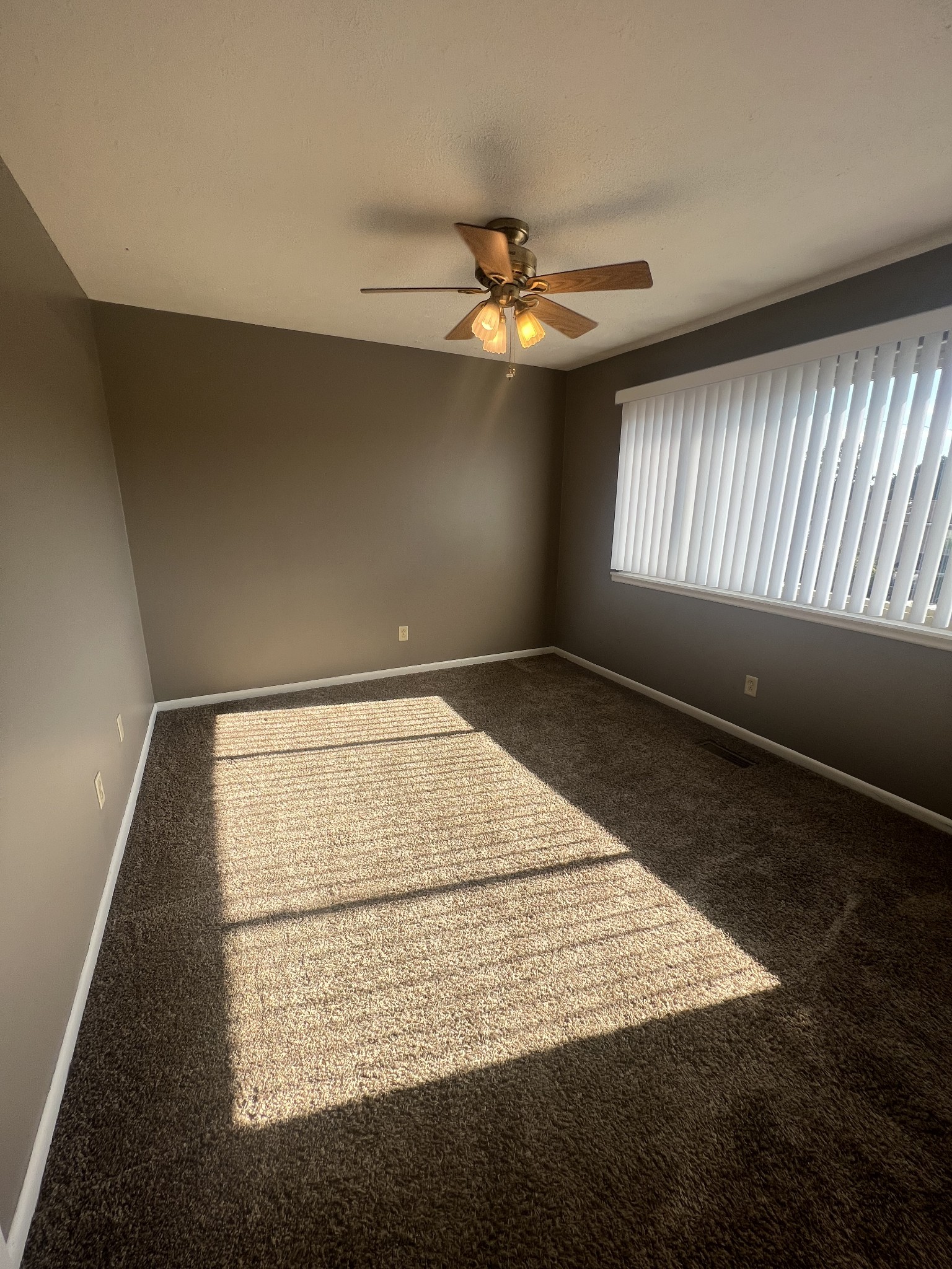 2169 Highway 41 South, Unit 28 Greenbrier, TN 37073 - Photo 6 of 7 an empty room with wooden floor and windows