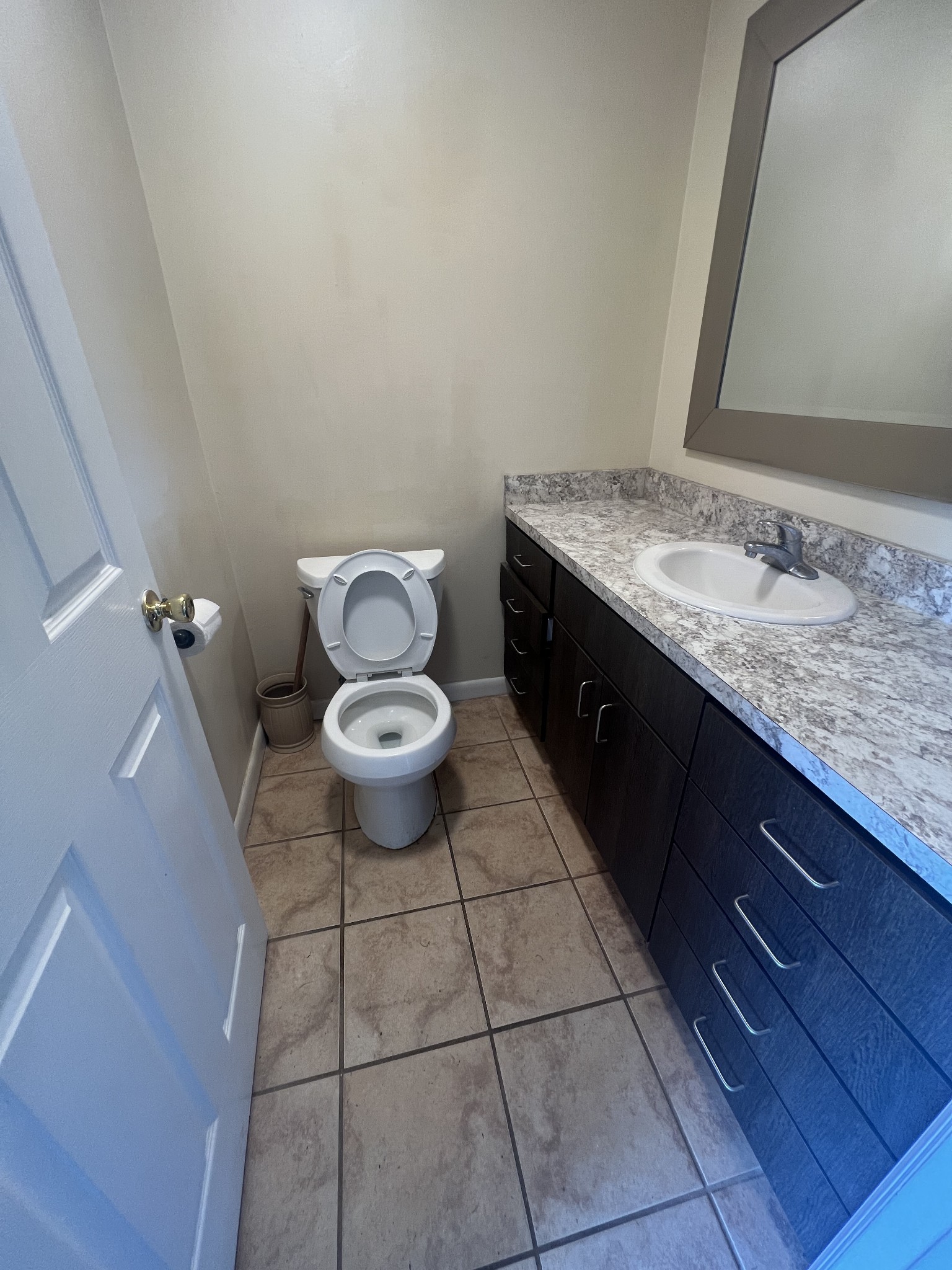 2169 Highway 41 South, Unit 28 Greenbrier, TN 37073 - Photo 7 of 7 a bathroom with a granite countertop toilet and a sink