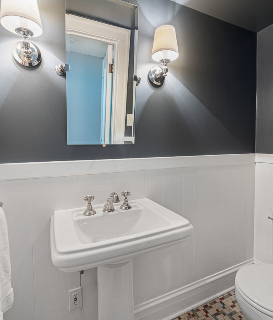 710 Bonnie Brae River Forest, IL 60305 - Photo 12 of 31 a bathroom with a sink and a mirror
