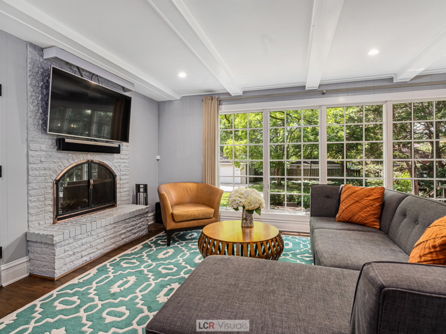 710 Bonnie Brae River Forest, IL 60305 - Photo 4 of 31 a living room with furniture a flat screen tv and a fireplace