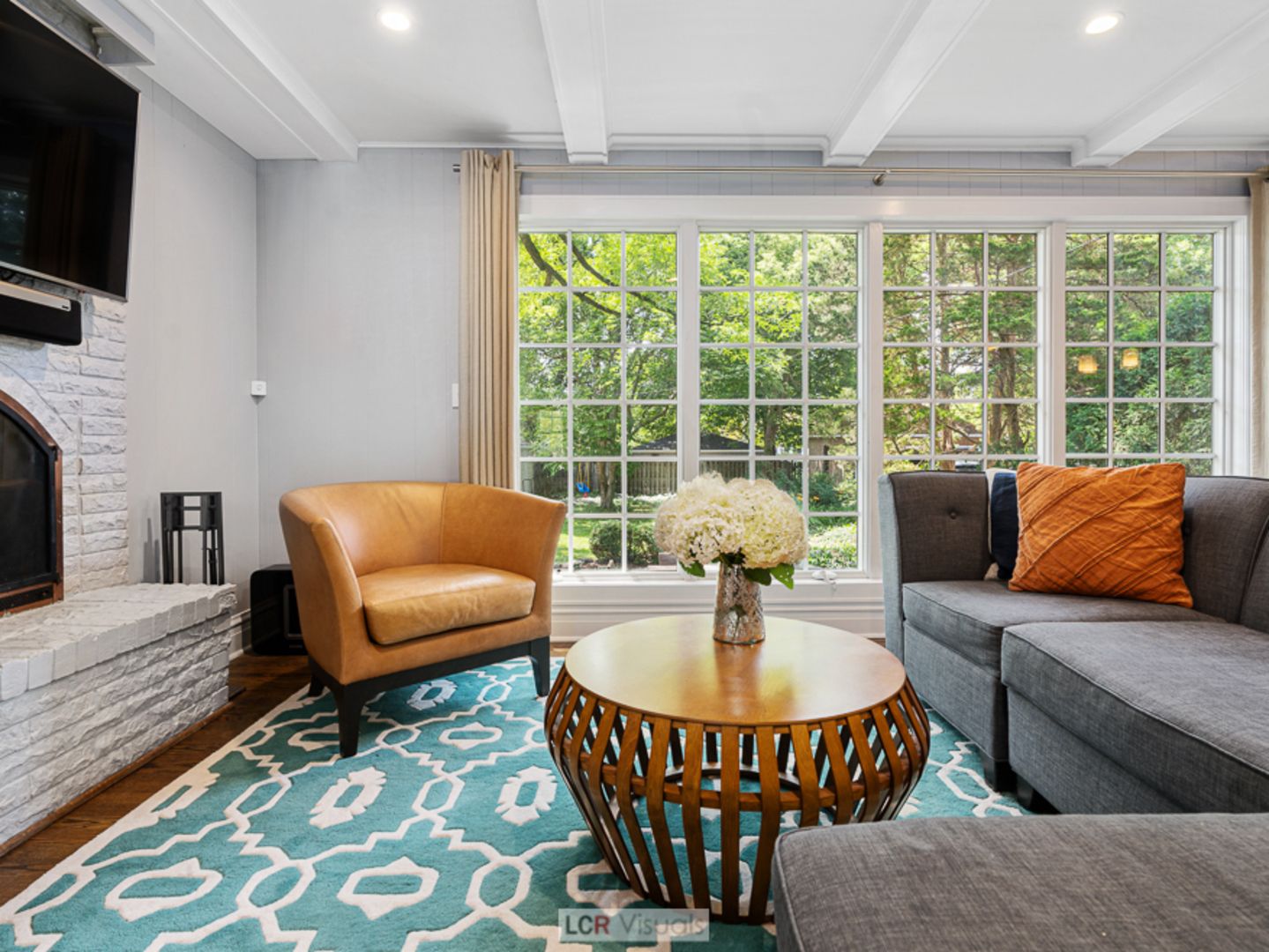 710 Bonnie Brae River Forest, IL 60305 - Photo 5 of 31 a living room with furniture a flat screen tv and a large window