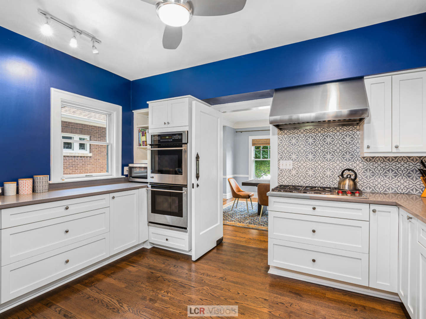 710 Bonnie Brae River Forest, IL 60305 - Photo 9 of 31 a kitchen with a white wooden cabinets and stove top oven