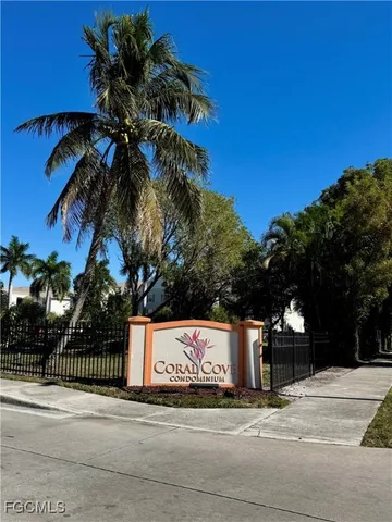 a view of a street with a building in the background