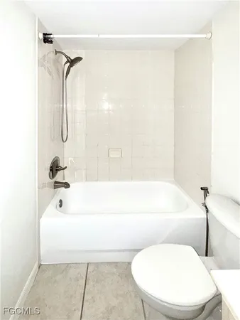 a bathroom with a toilet and a bathtub