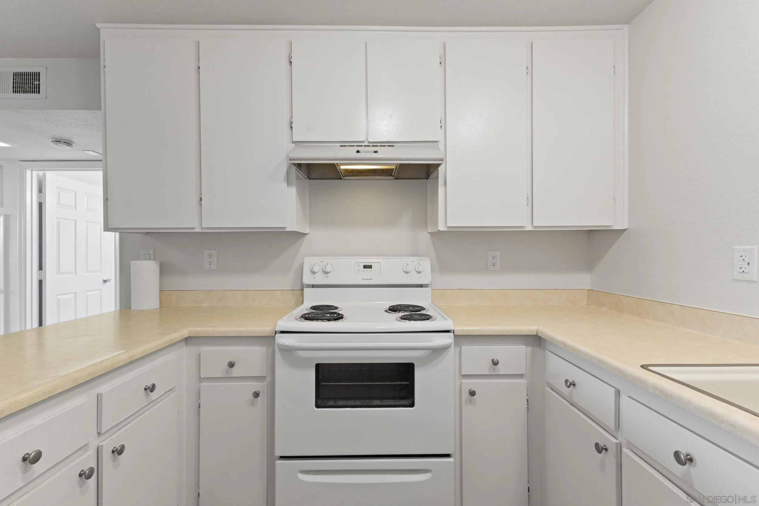 1604 Montecito Road, Unit 20 Ramona, CA 92065 - Photo 1 of 21 a kitchen with granite countertop white cabinets and white appliances