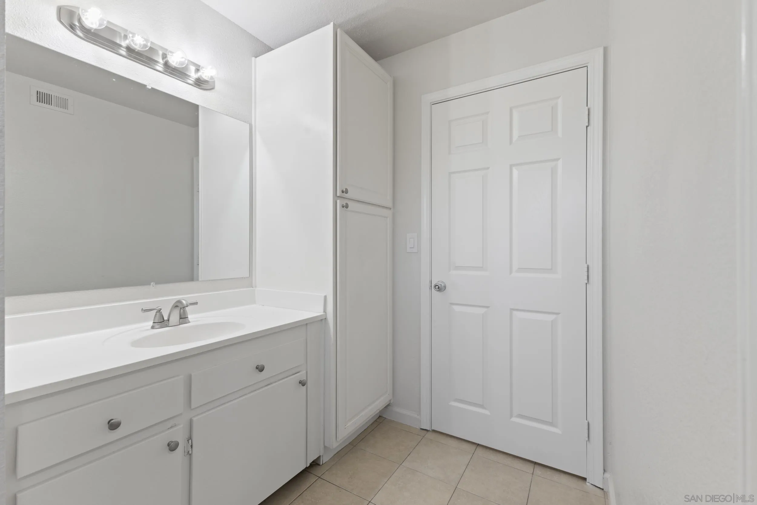 1604 Montecito Road, Unit 20 Ramona, CA 92065 - Photo 9 of 21 a bathroom with a double vanity sink and a mirror