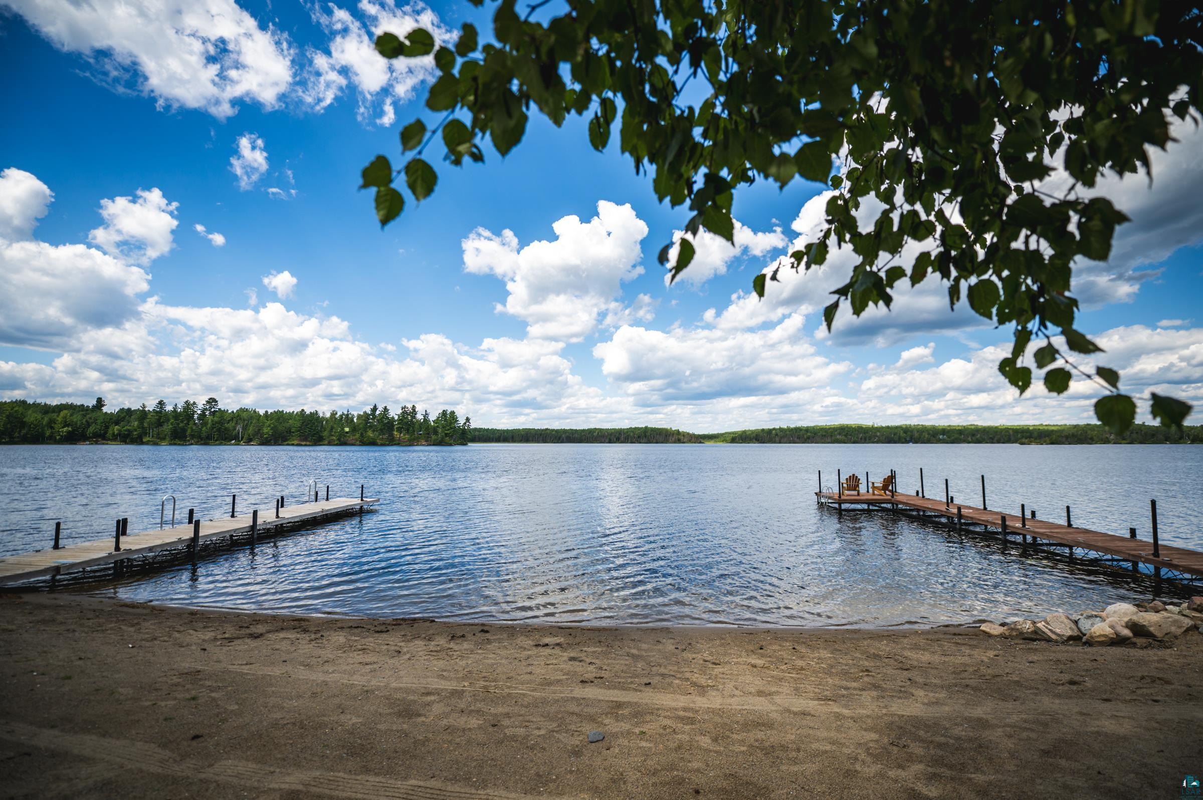 14635 Canadian Border Road Ely, MN 55731 - Photo 40 of 94 Sandy shoreline with two extended wooden docks