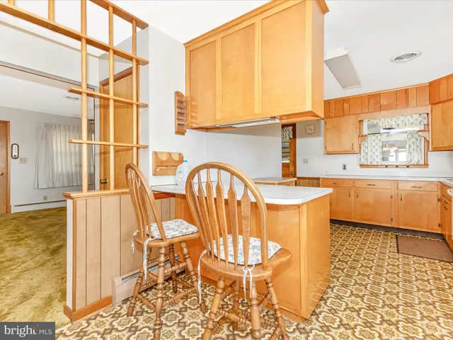a utility room with sink dryer and washer