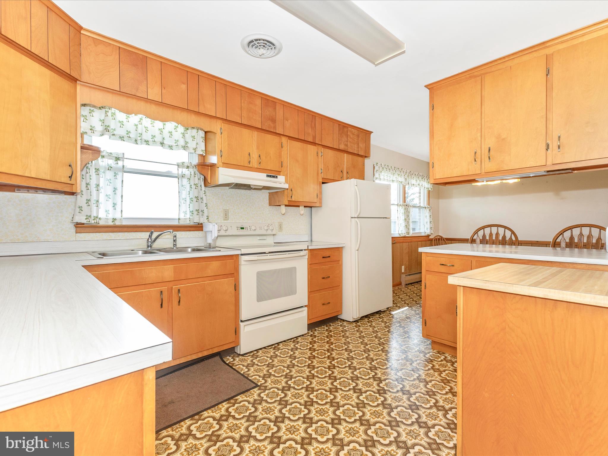 4509 Valley View Road Middletown, MD 21769 - Photo 14 of 51 a kitchen with a refrigerator and a stove