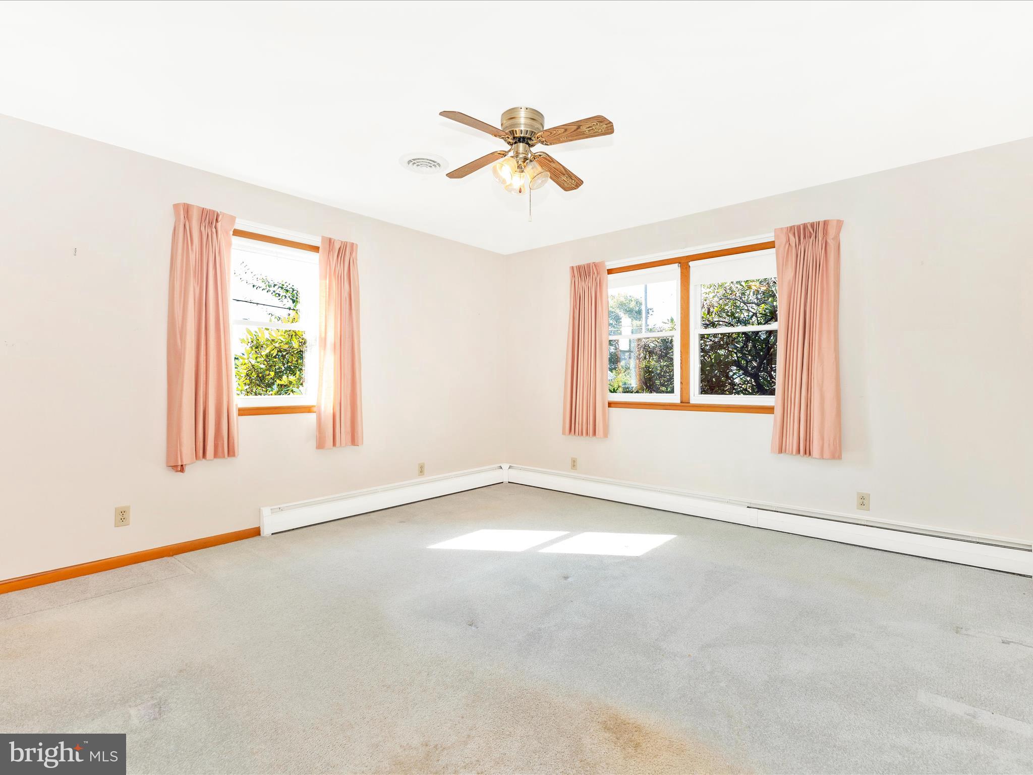 4509 Valley View Road Middletown, MD 21769 - Photo 16 of 51 an empty room with a window and a ceiling fan