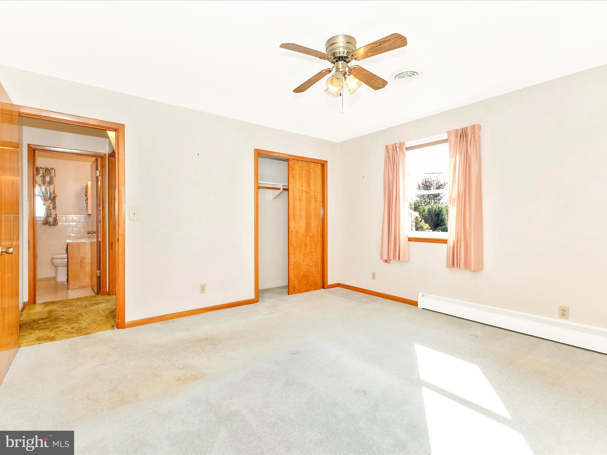 4509 Valley View Road Middletown, MD 21769 - Photo 17 of 51 an empty room with windows and a chandelier fan