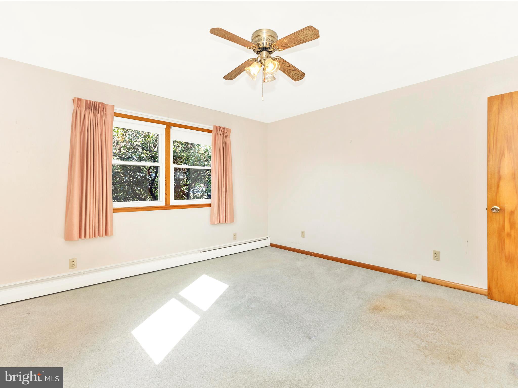 4509 Valley View Road Middletown, MD 21769 - Photo 18 of 51 an empty room with chandelier fan and windows