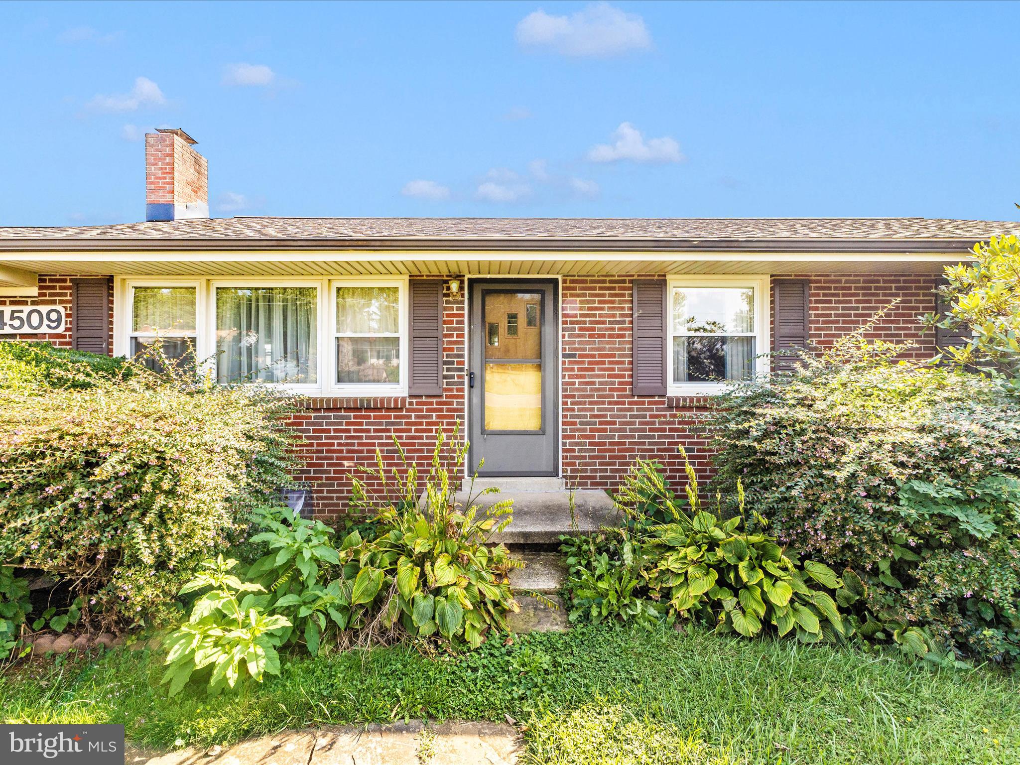 4509 Valley View Road Middletown, MD 21769 - Photo 2 of 51 a front view of a house with a big yard and potted plants