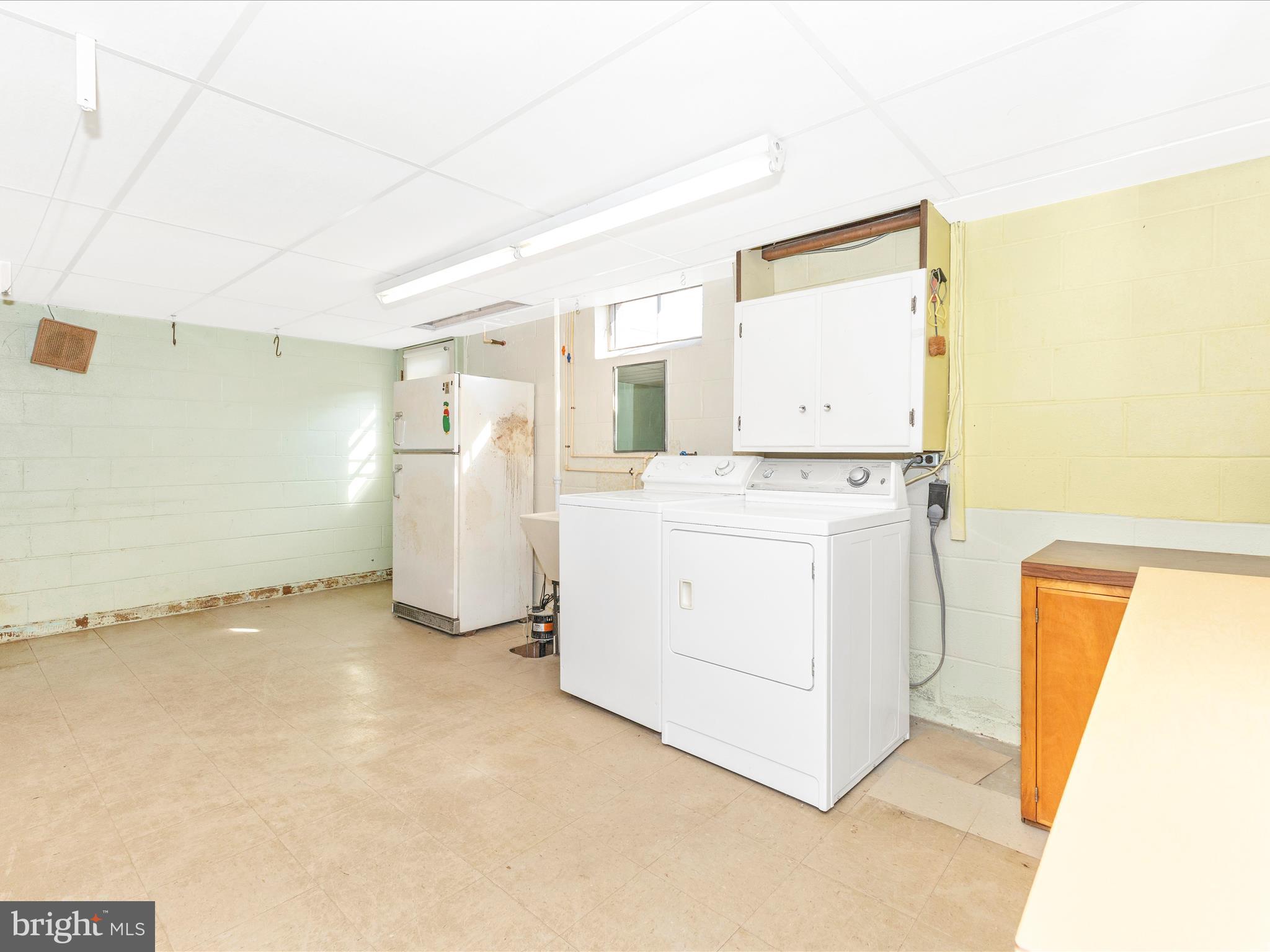4509 Valley View Road Middletown, MD 21769 - Photo 36 of 51 a view of a storage & utility room with dryer and washer