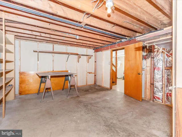 a room with pool table and windows