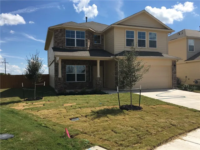 a house with yard in front of it