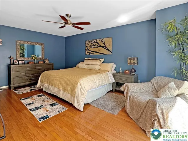 a spacious bathroom with a double vanity sink and a mirror