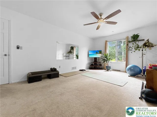 a view of a hallway with washer and dryer