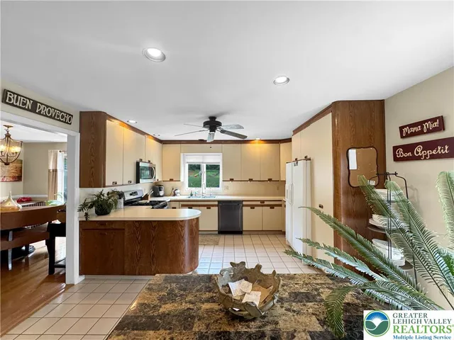 a kitchen with lots of counter top space and living room