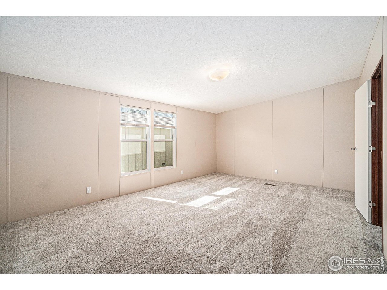 230 North 2nd Street, Unit 76A Berthoud, CO 80513 - Photo 7 of 13 a view of an empty room with a window