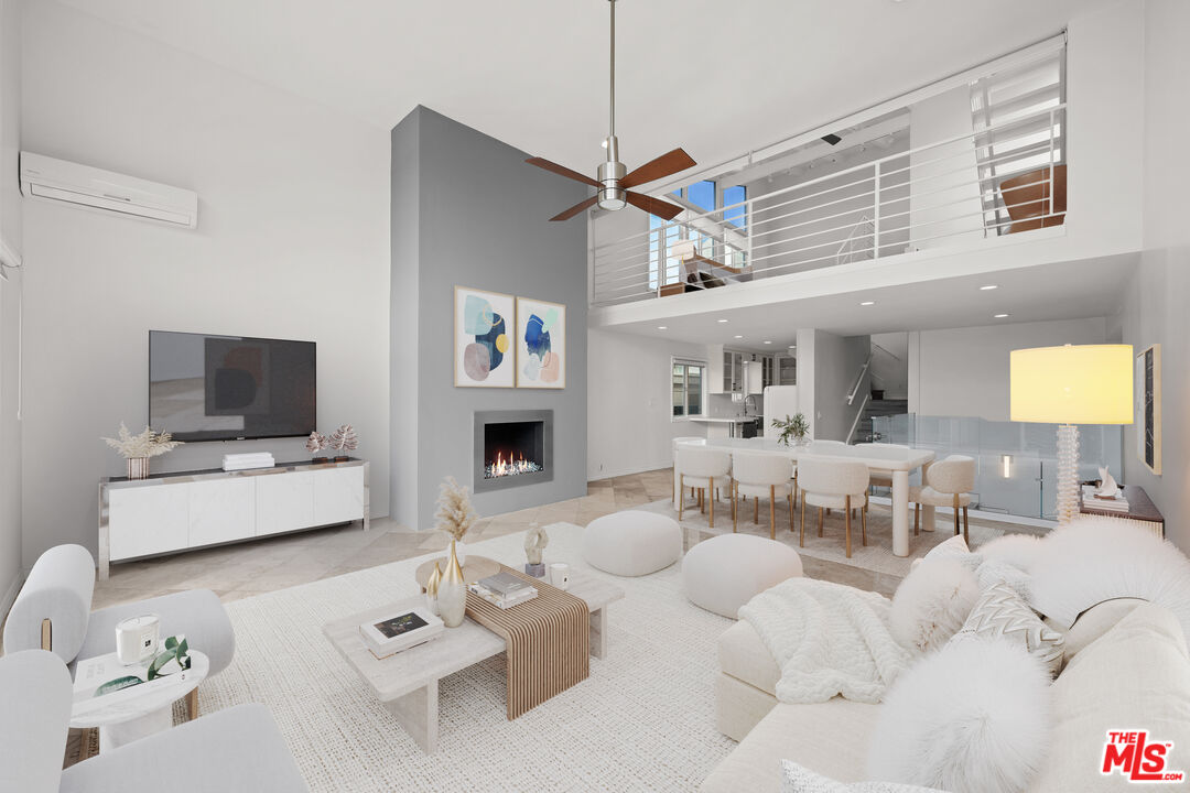 29 Yawl Street, Unit B Marina del Rey, CA 90292 - Photo 2 of 14 a living room with furniture and a flat screen tv