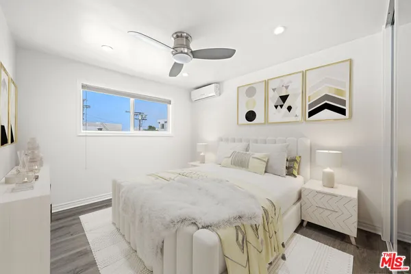 a bedroom with a bed and a walk in closet