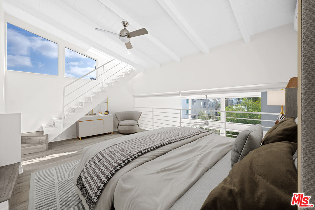 29 Yawl Street, Unit B Marina del Rey, CA 90292 - Photo 5 of 14 a bedroom with a bed couch and a large window