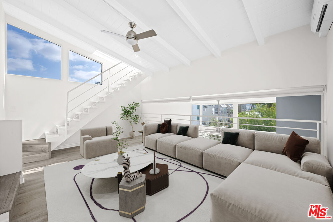 29 Yawl Street, Unit B Marina del Rey, CA 90292 - Photo 7 of 14 a living room with furniture and a large window