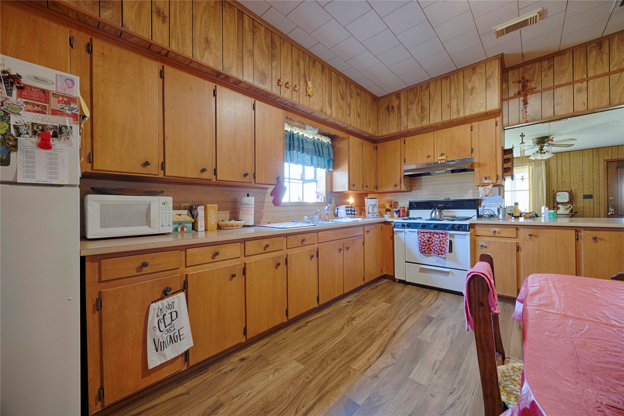 602 East Post Office Street Weimar, TX 78962 - Photo 11 of 21 a kitchen with kitchen island granite countertop wooden cabinets stainless steel appliances and a counter