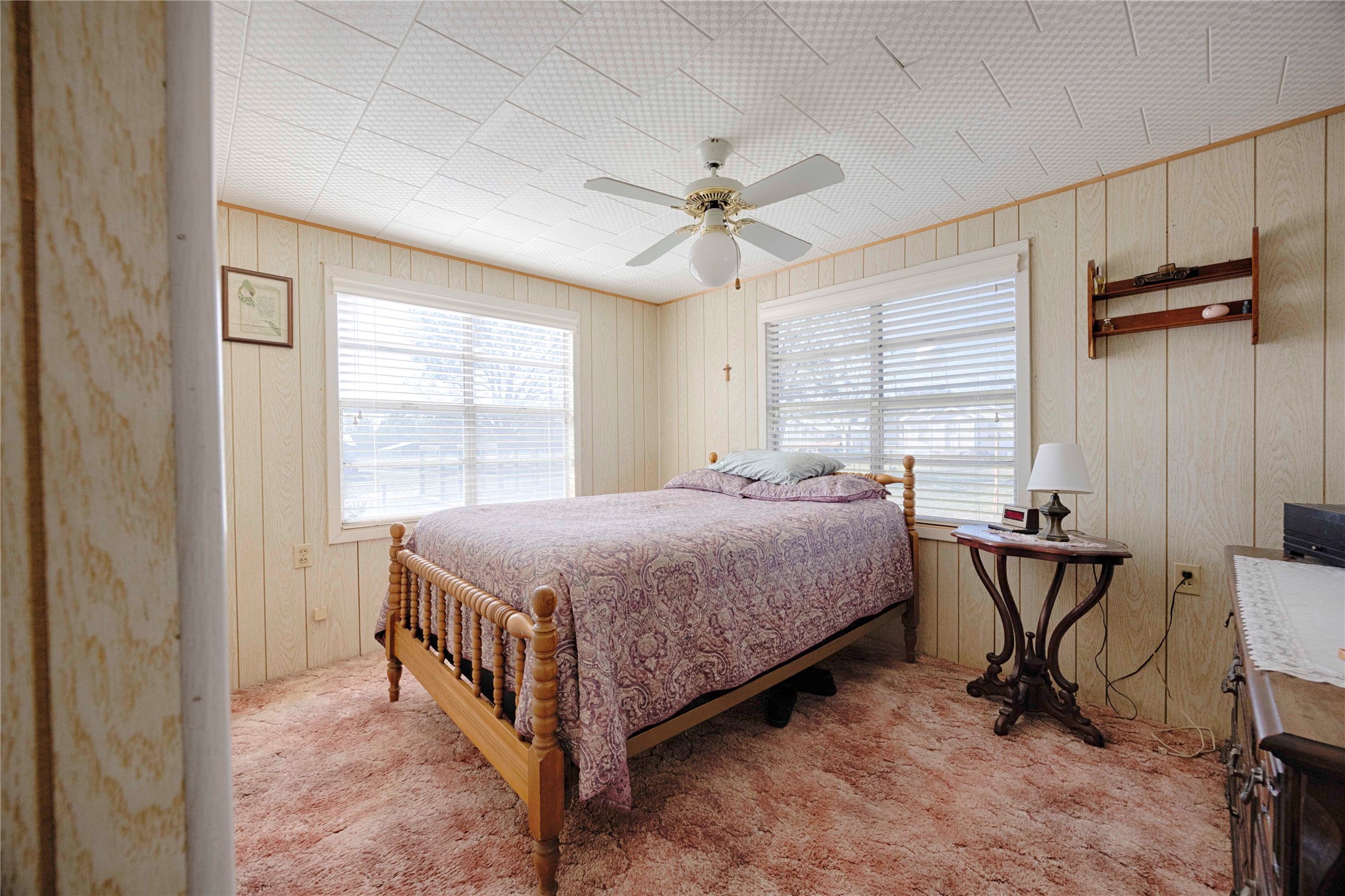 602 East Post Office Street Weimar, TX 78962 - Photo 14 of 21 a bedroom with a bed closet and a window