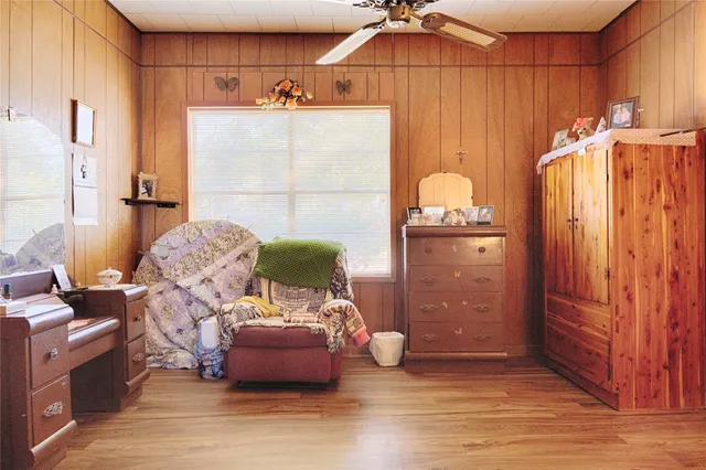 a bedroom with furniture and a chandelier