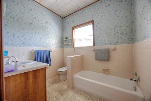 a bathroom with a sink toilet and bathtub