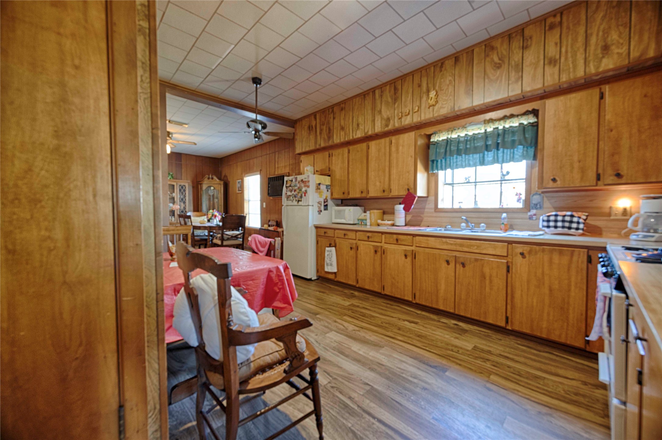 602 East Post Office Street Weimar, TX 78962 - Photo 10 of 21 a kitchen with a sink cabinets and window