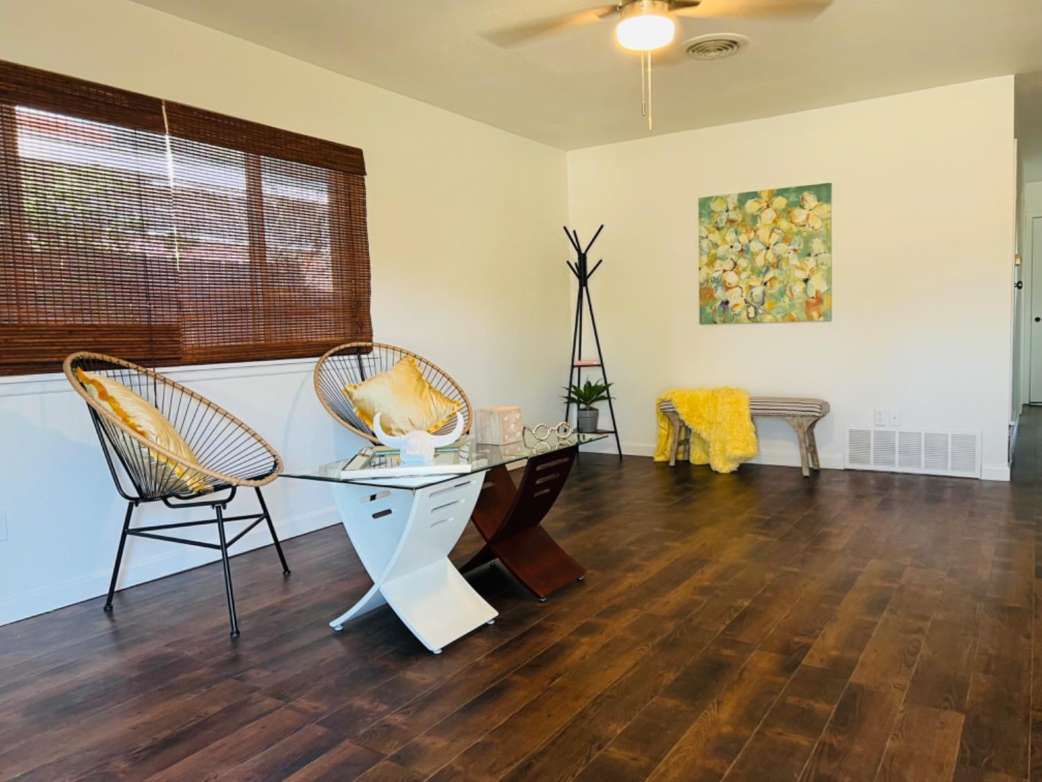 2107 57th Street Lubbock, TX 79412 - Photo 2 of 11 a view of a workspace with furniture and wooden floor