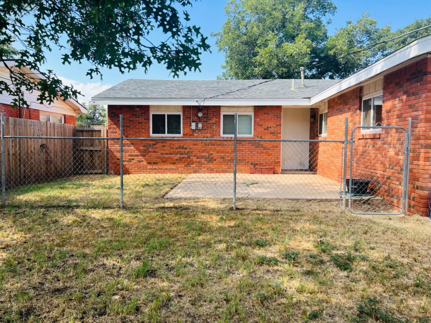 2107 57th Street Lubbock, TX 79412 - Photo 10 of 11 a backyard of a house