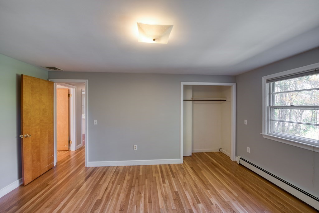 46 Prospect Street Sherborn, MA 01770 - Photo 12 of 40 an empty room with wooden floor and windows
