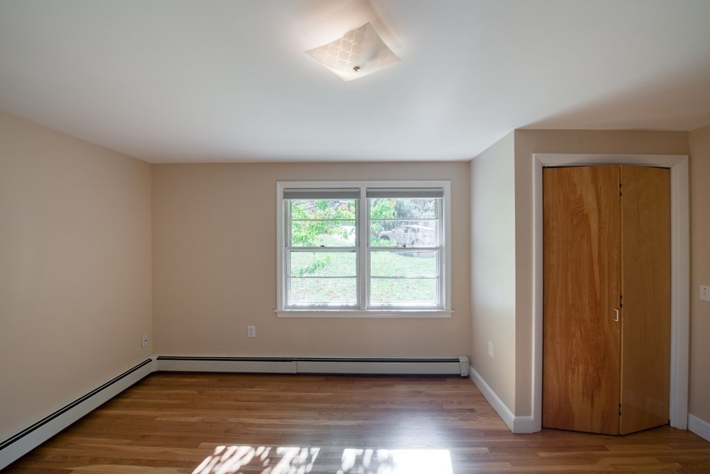 46 Prospect Street Sherborn, MA 01770 - Photo 14 of 40 an empty room with wooden floor and windows