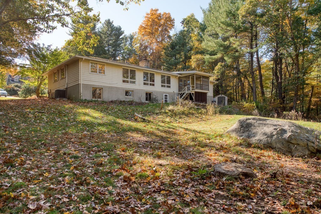 46 Prospect Street Sherborn, MA 01770 - Photo 30 of 40 a view of house with yard and trees in the background