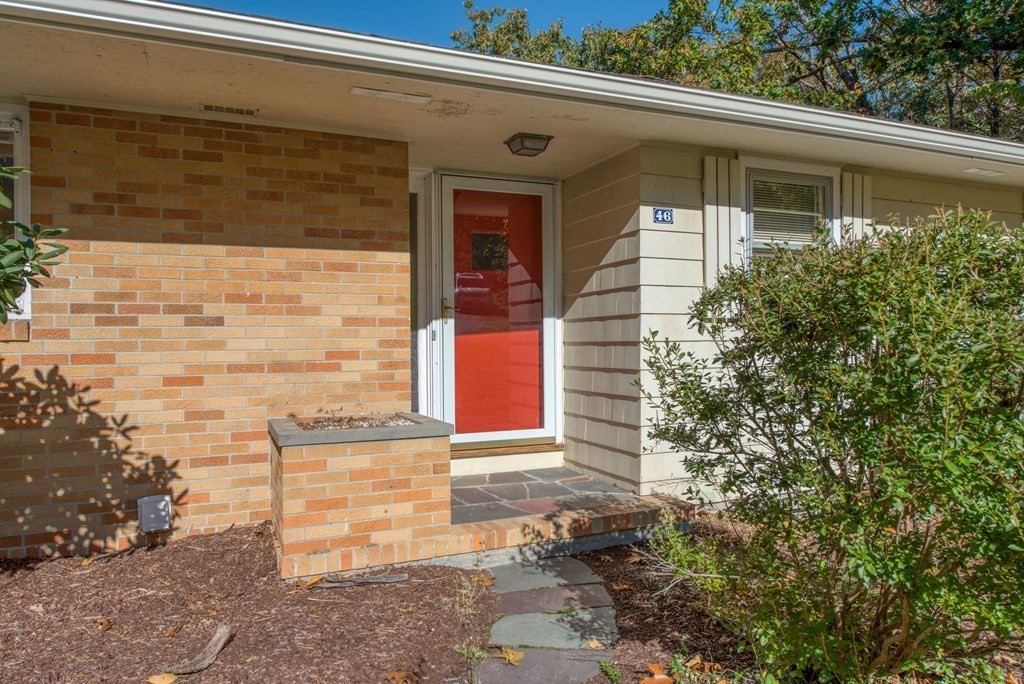46 Prospect Street Sherborn, MA 01770 - Photo 3 of 40 a front view of a house with a yard