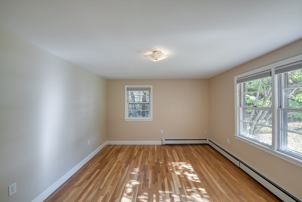 46 Prospect Street Sherborn, MA 01770 - Photo 6 of 40 wooden floor in an empty room with a window