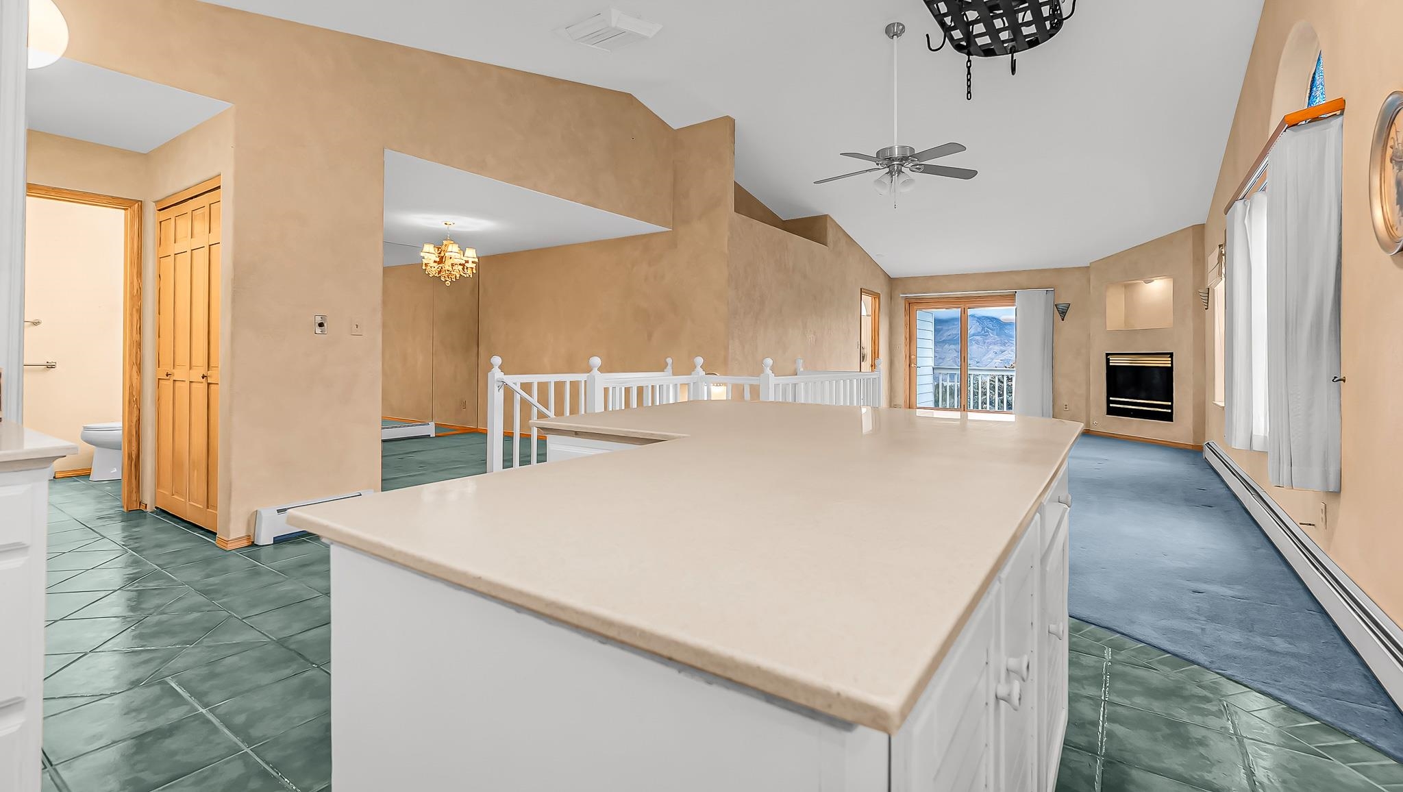 12 West Ridge Court Parachute, CO 81635 - Photo 5 of 37 a large white kitchen with a large window