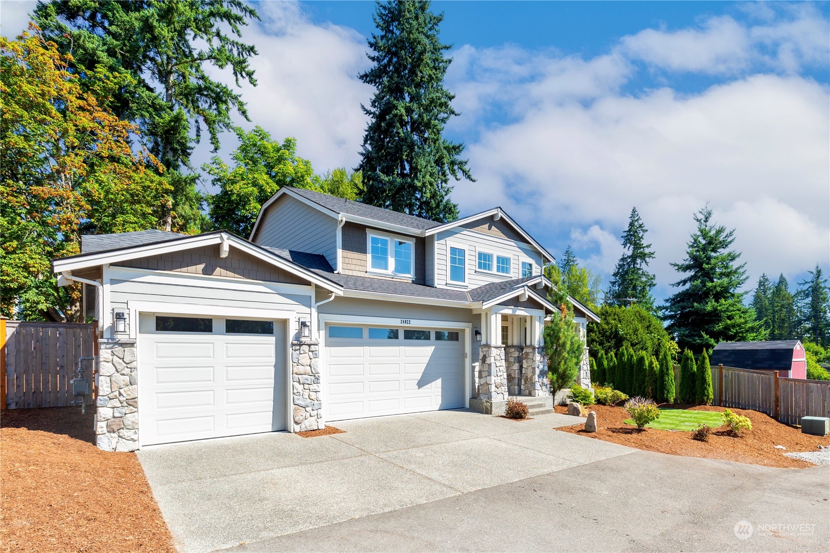 24022 Meridian Avenue South Bothell, WA 98021 - Photo 2 of 36 a front view of a house with a garage