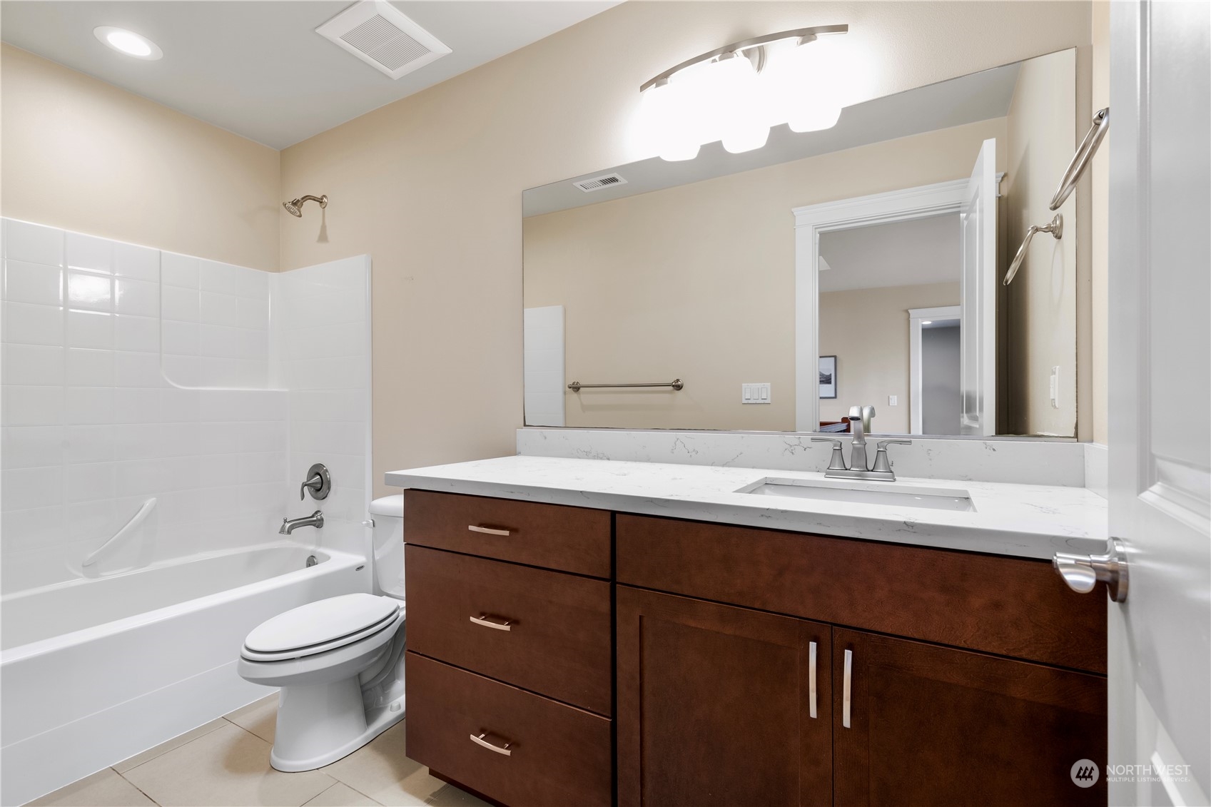 24022 Meridian Avenue South Bothell, WA 98021 - Photo 23 of 36 a bathroom with a toilet a sink a tub and a mirror