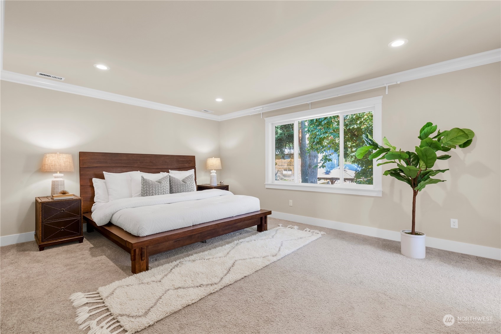 24022 Meridian Avenue South Bothell, WA 98021 - Photo 26 of 36 a spacious bedroom with a bed and a window