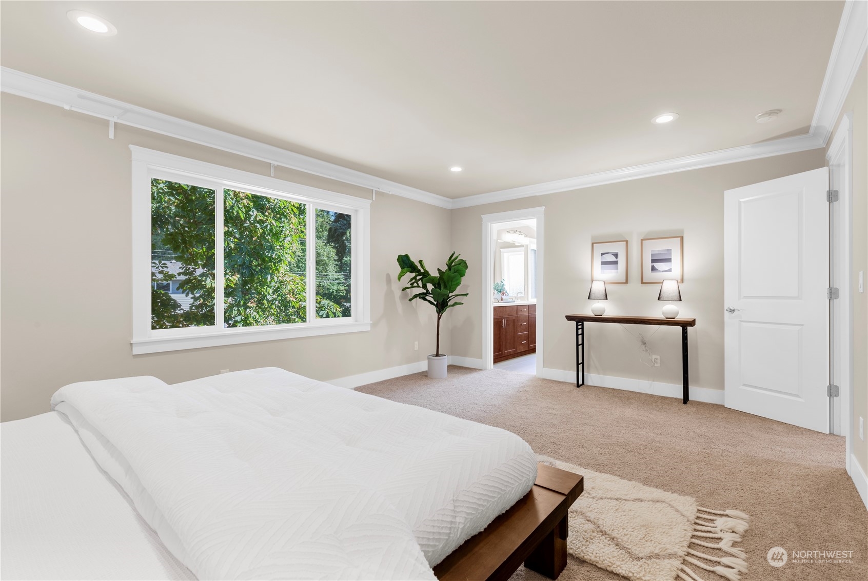 24022 Meridian Avenue South Bothell, WA 98021 - Photo 28 of 36 a spacious bedroom with a bed and a cabinets