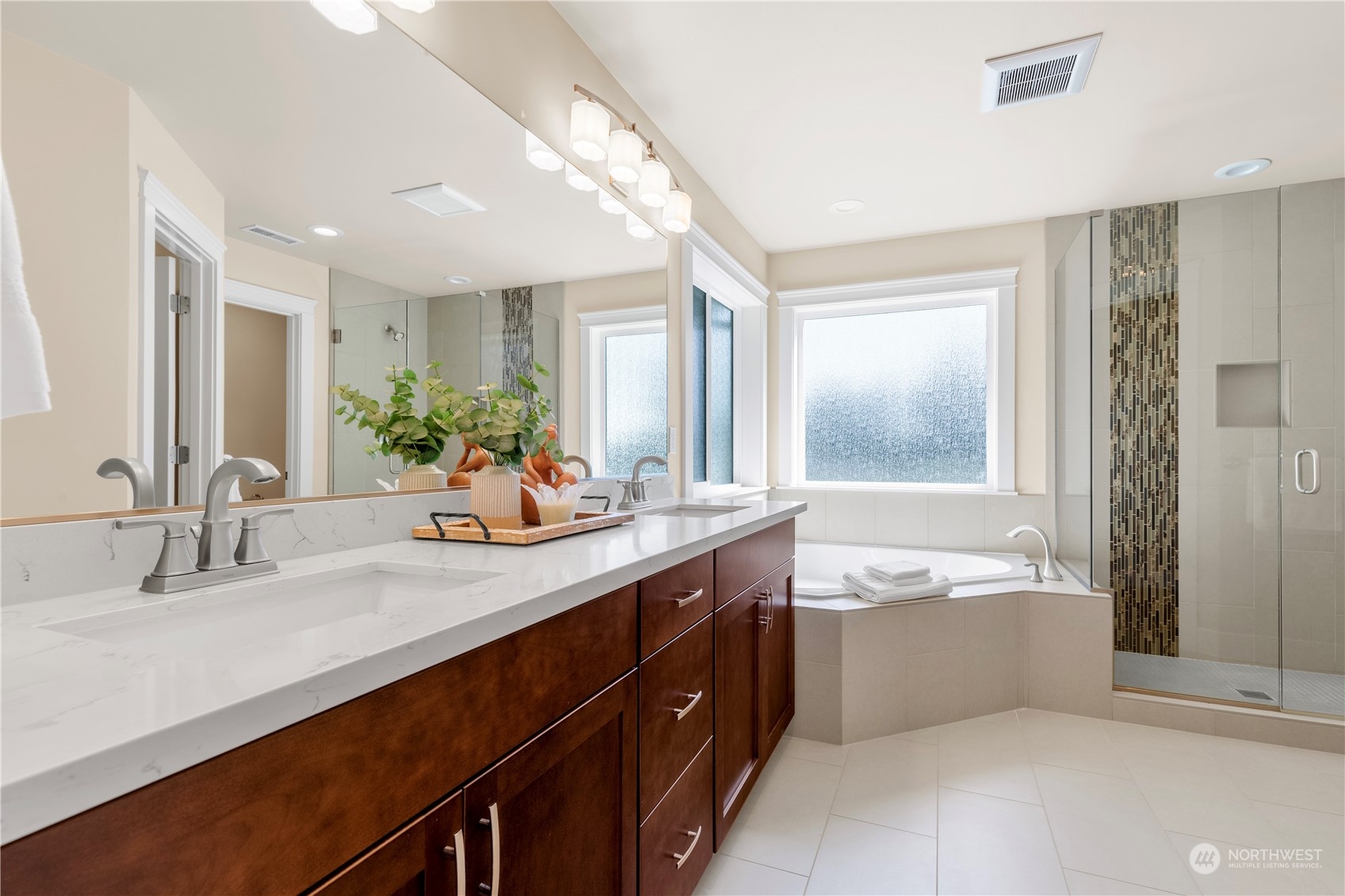 24022 Meridian Avenue South Bothell, WA 98021 - Photo 29 of 36 a bathroom with a tub sink and mirror