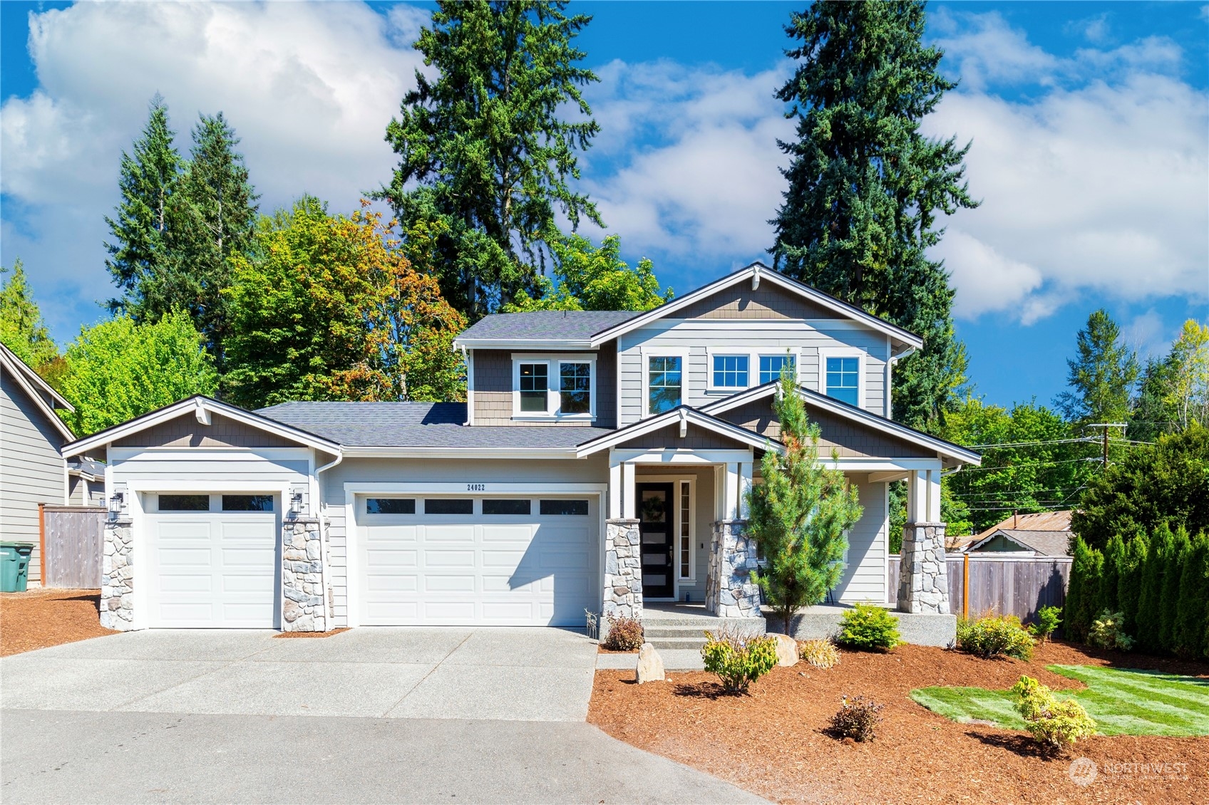 24022 Meridian Avenue South Bothell, WA 98021 - Photo 36 of 36 a front view of a house with a yard and garage