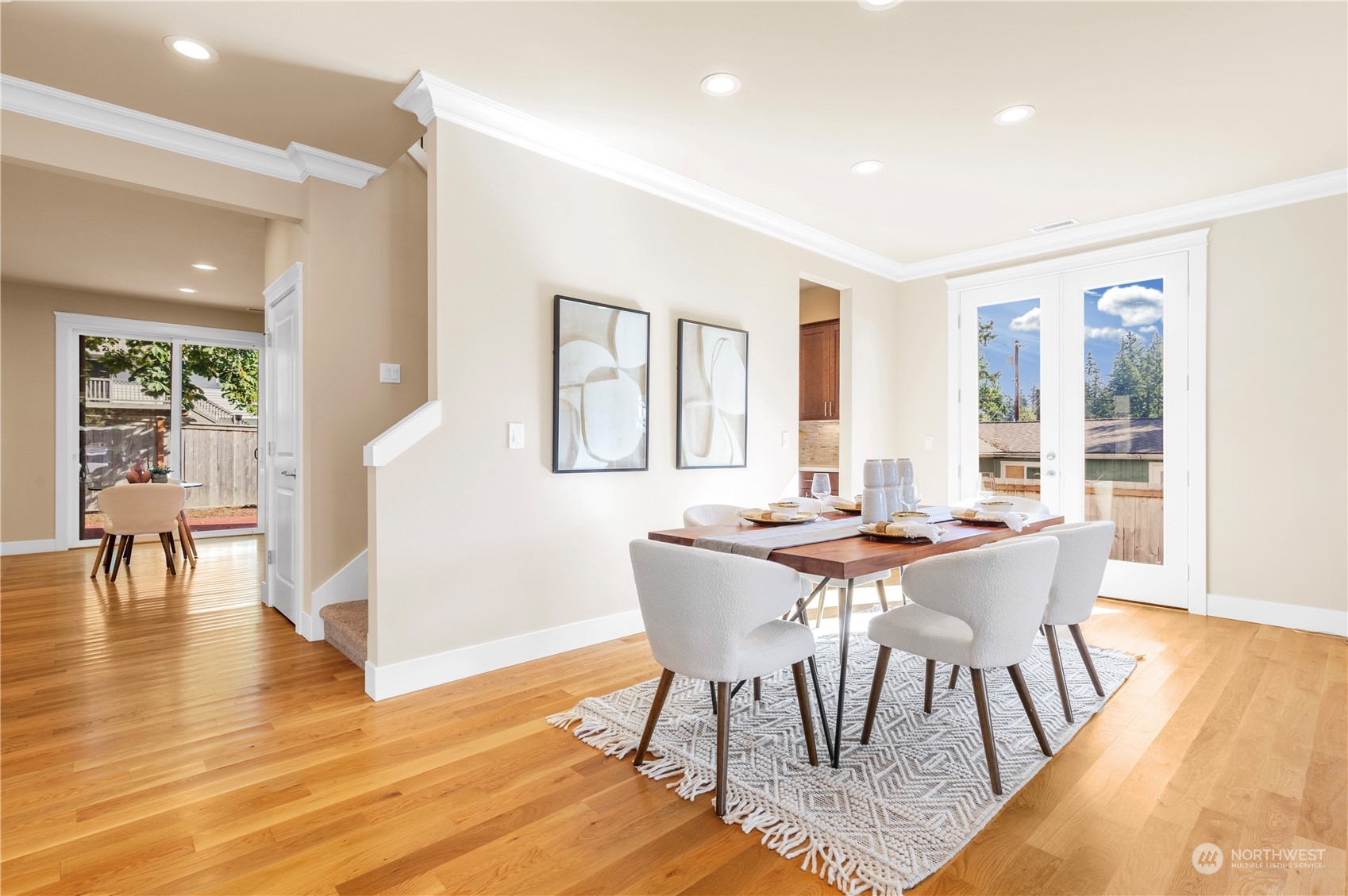 24022 Meridian Avenue South Bothell, WA 98021 - Photo 5 of 36 a view of a dining room with furniture and wooden floor