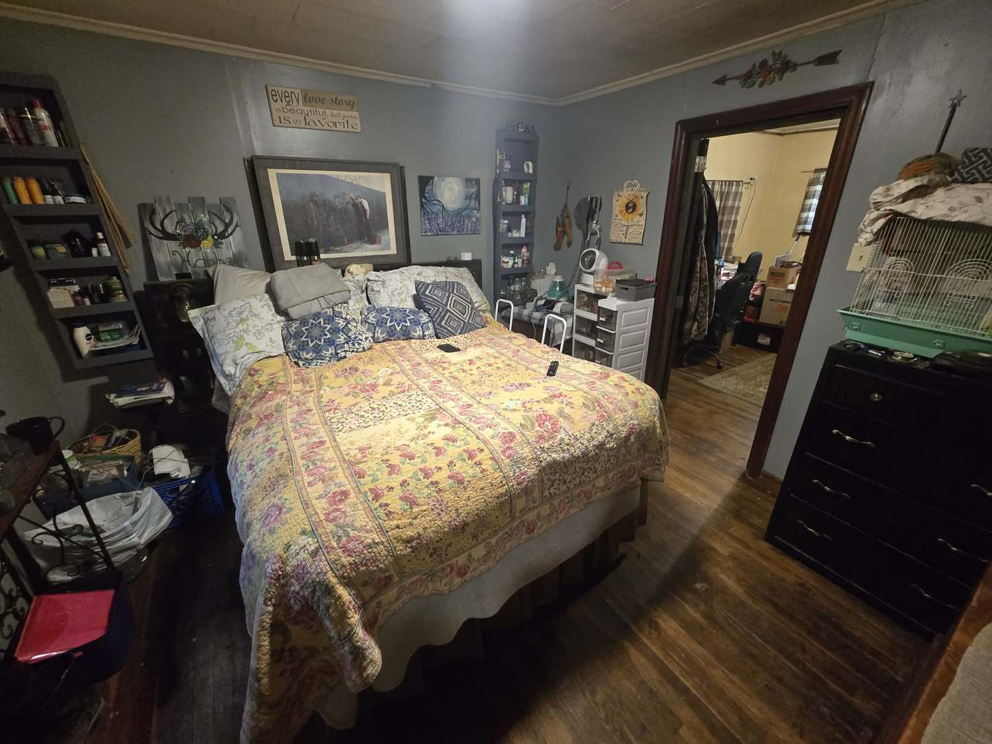 208 West Bryan Street Herrin, IL 62948 - Photo 19 of 27 a bed sitting in a bedroom next to a window with tv and couch